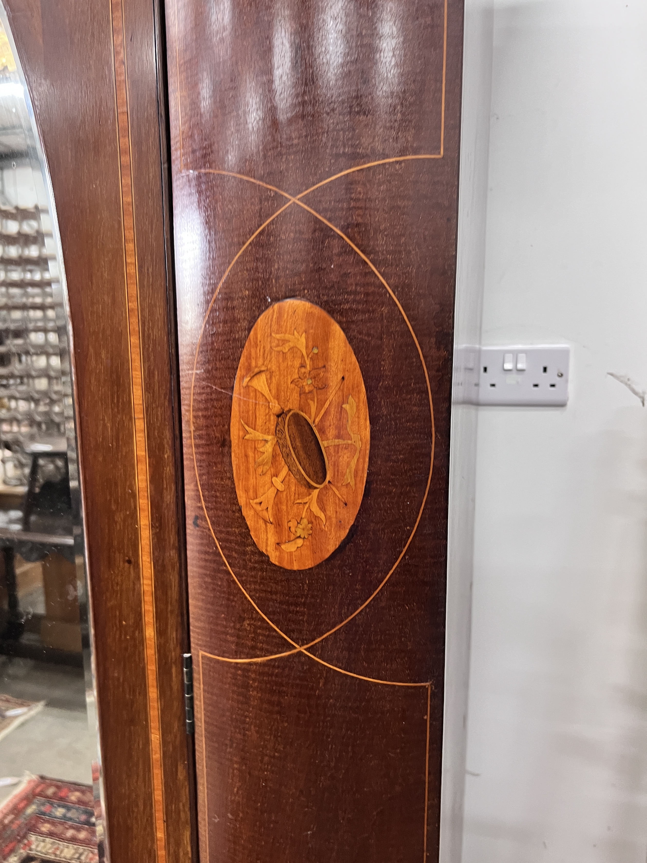 An Edwardian satinwood banded mahogany mirrored door wardrobe, width 162cm, depth 58cm, height 207cm